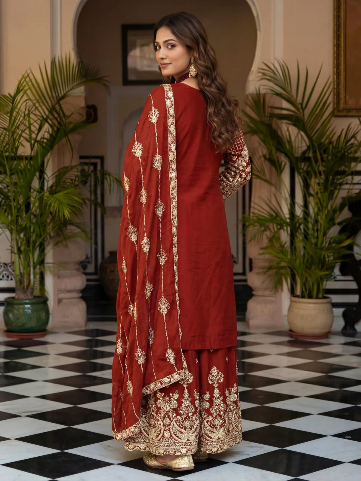 Tarani maroon silk festive wear dress back pose with embroidered palazzo and dupatta