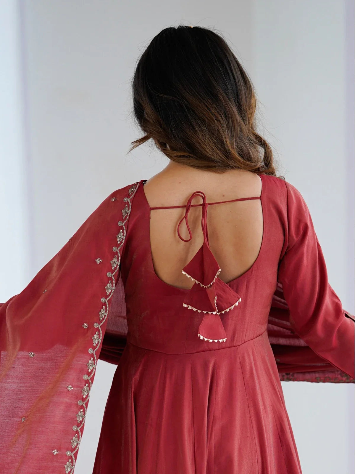 Tarani maroon silk Anarkali dress back view with tassel tie-up and detailing