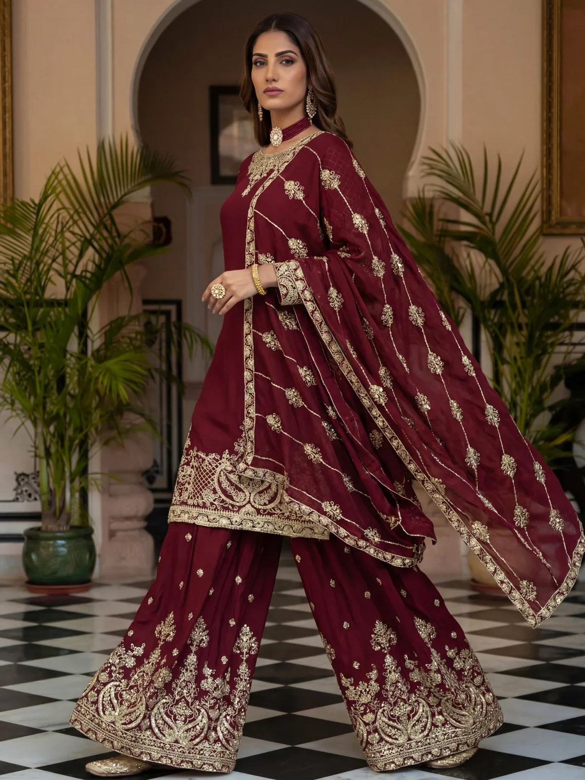 Tarani full view maroon silk party dress with golden design and palazzo