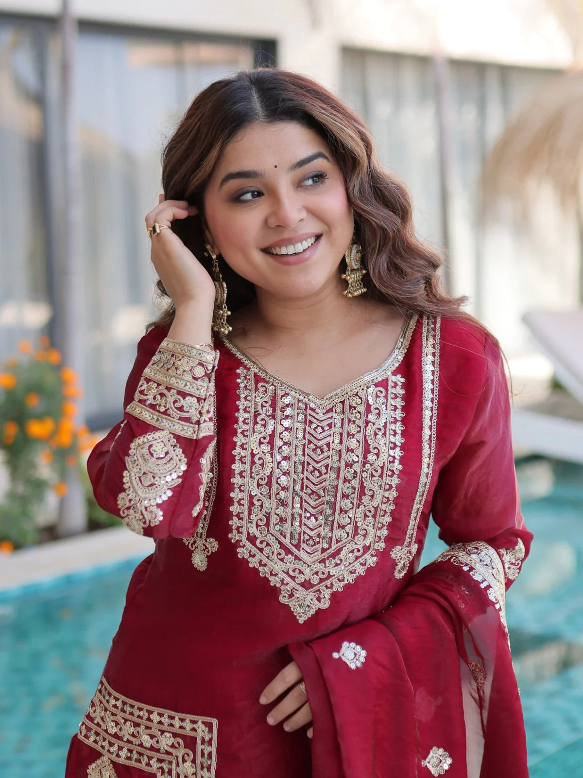 Tarani maroon silk dress closeup with neckline and sleeve embroidery details