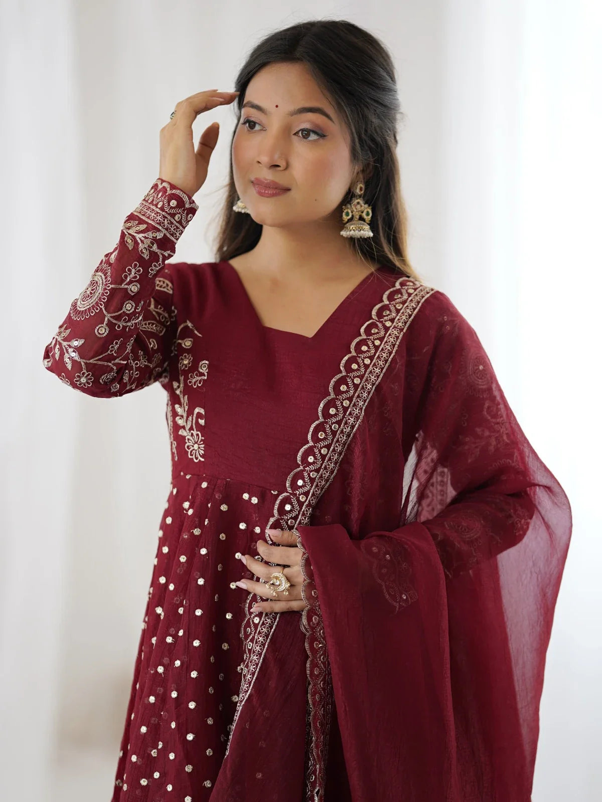 Tarani maroon silk embroidered dress upper body design close view
