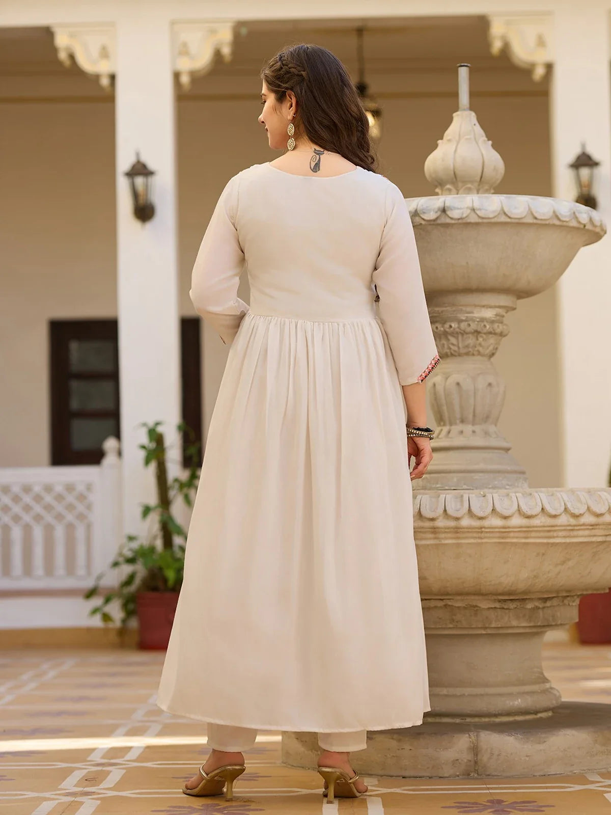 Tarani off white silk dress back side showing full flare and fit