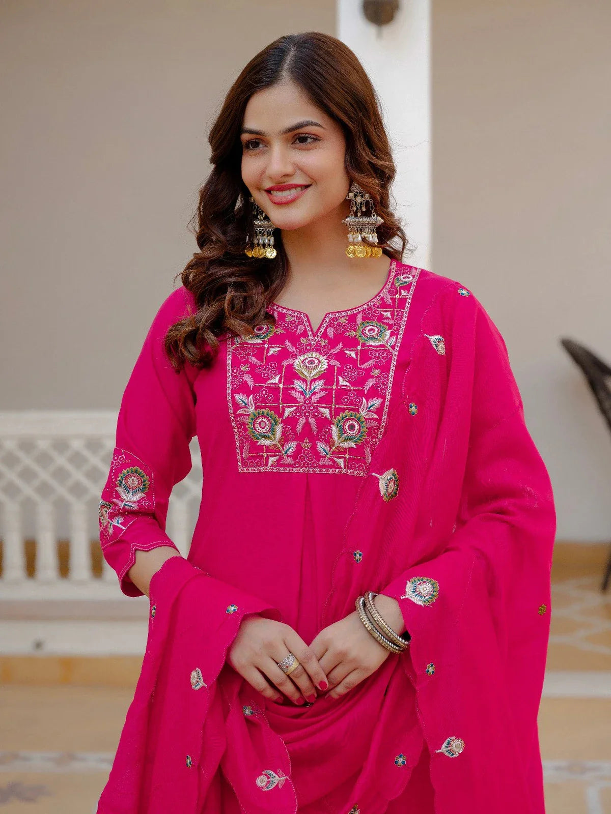 Tarani premium pink silk kurti close-up with detailed neckline embroidery and festive styling