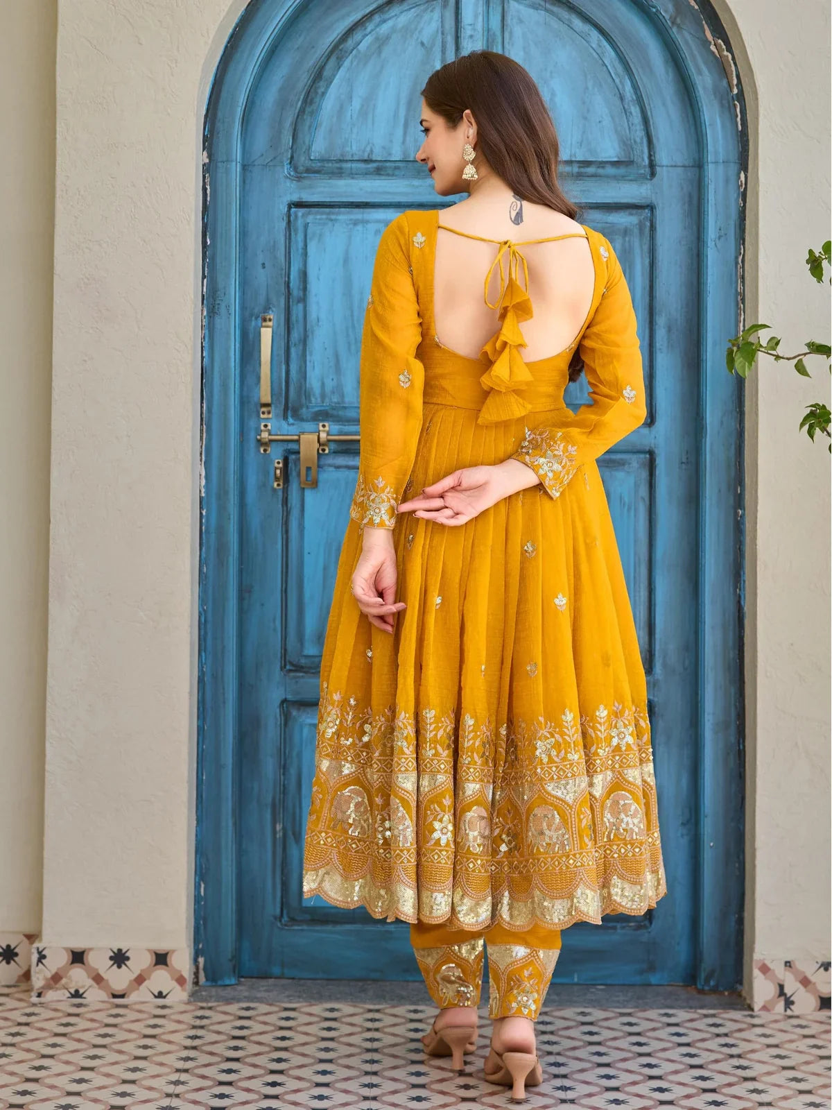 Tarani yellow silk dress with back design and tie-up dori from back view