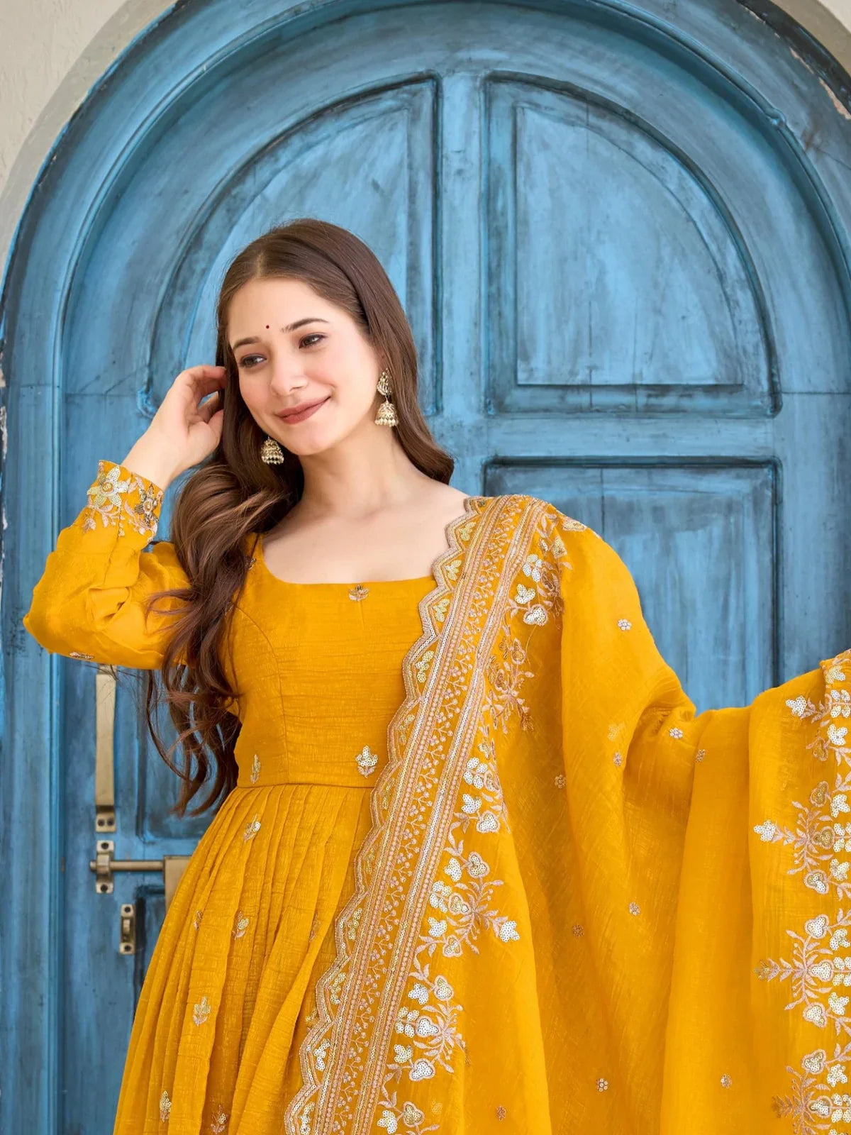 Tarani elegant yellow silk dress with detailed neckline and embroidery close up