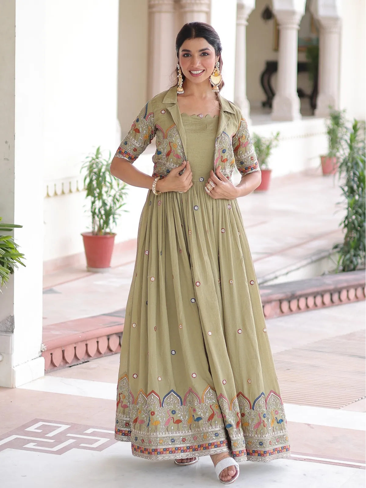 Tarani premium green embroidered silk gown full front view with koti and ethnic flare