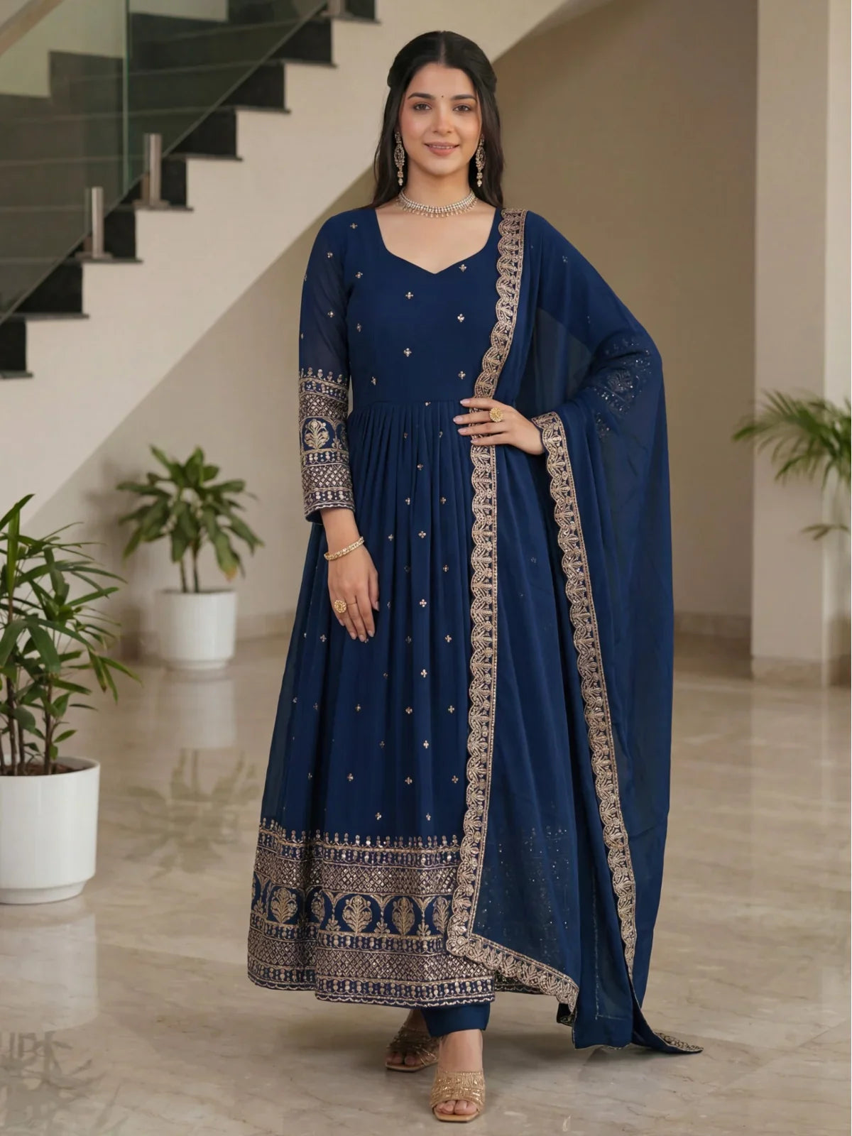 Tarani premium navy blue silk gown full view with golden embroidery for festive events