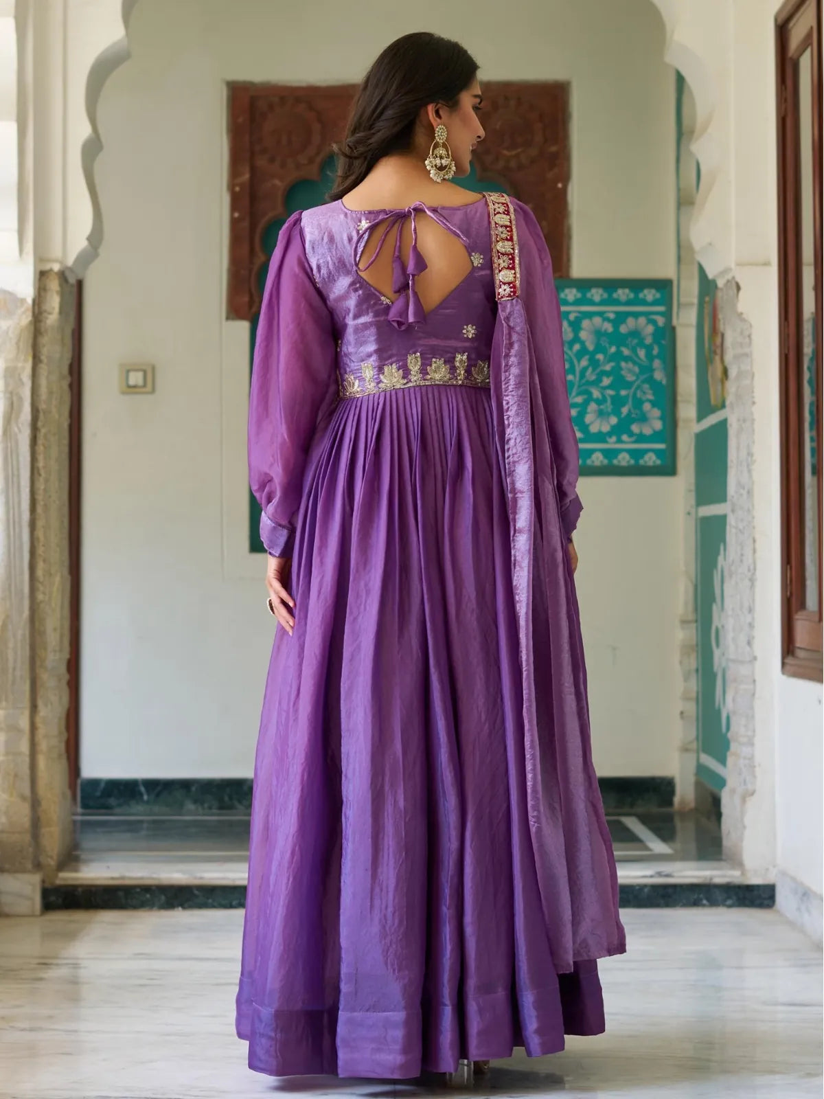 Tarani purple silk gown back view with keyhole tie design and golden thread work