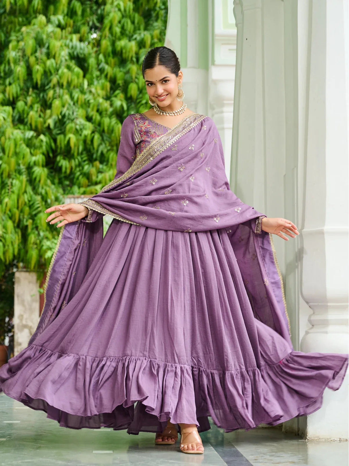Tarani full-length purple silk gown with frilled hem and festive flare
