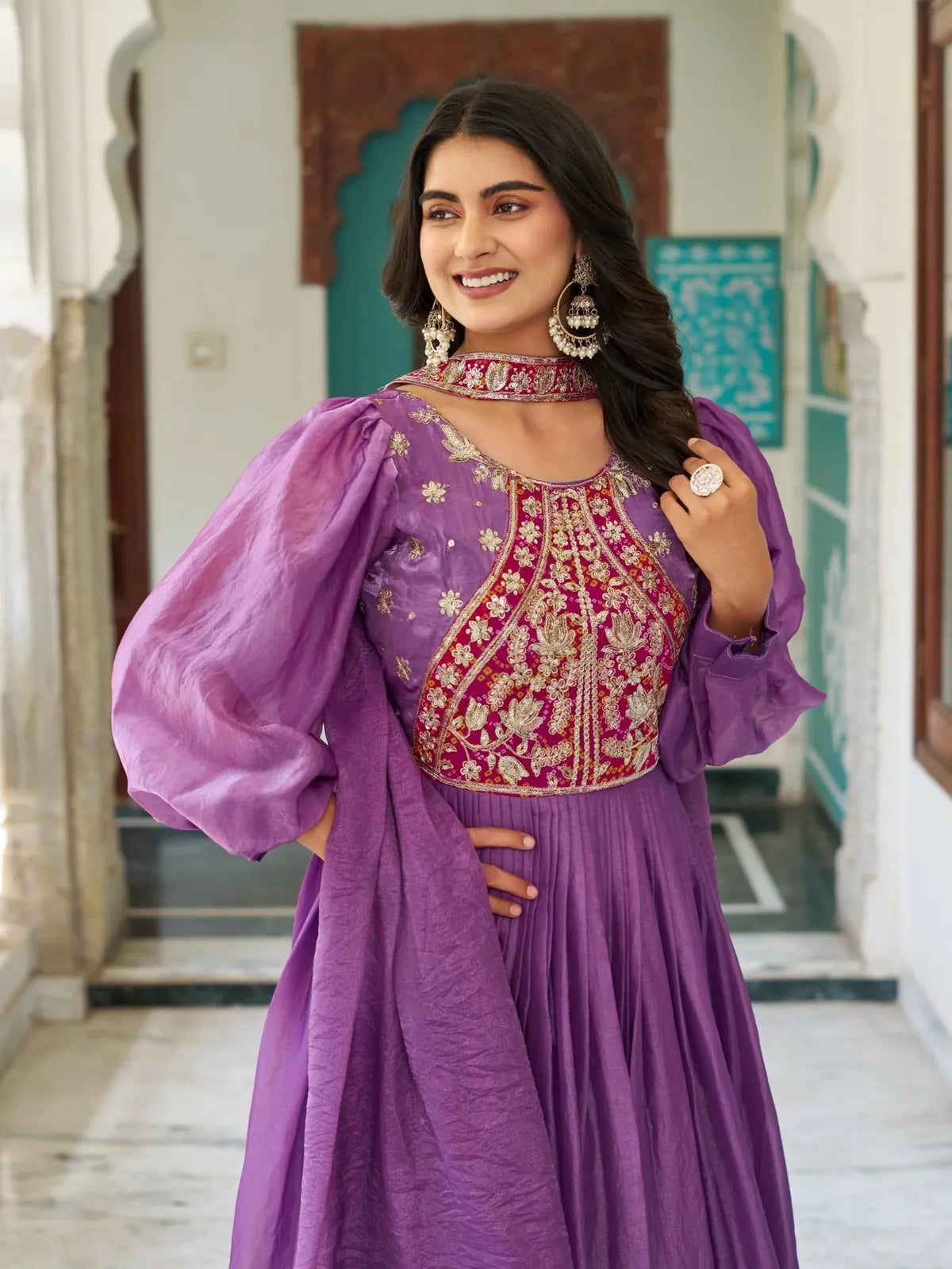 Tarani purple silk gown upper body view showing neckline embroidery and earrings