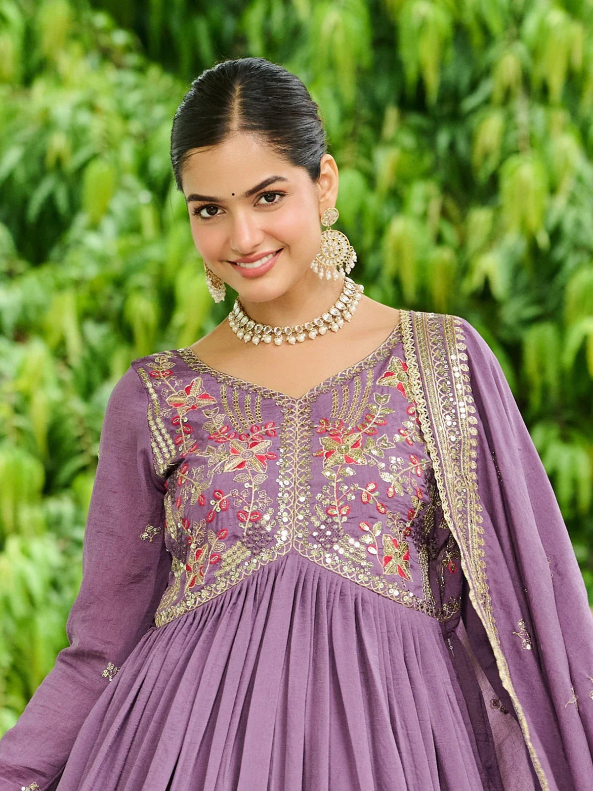 Tarani embroidered purple silk gown upper-body closeup with designer v-neck and mirror work