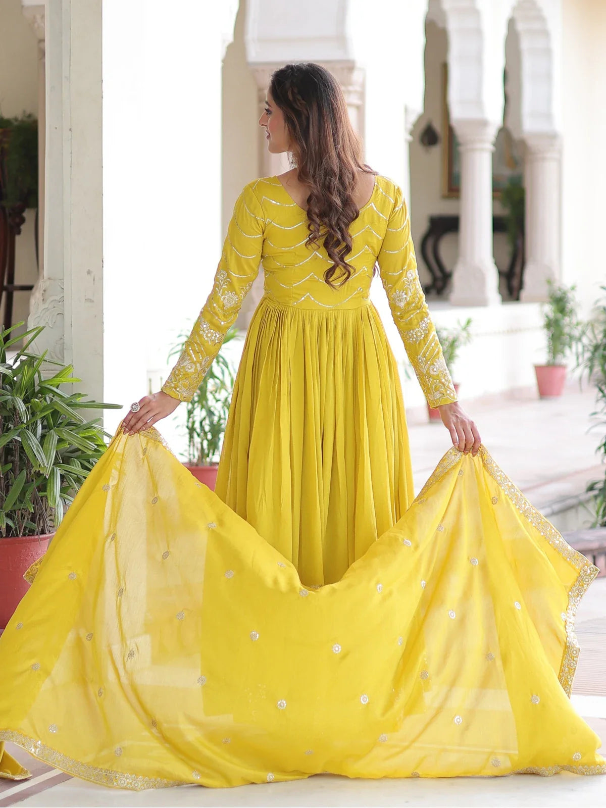 Tarani yellow silk gown full back view with detailed embroidery and dupatta styling