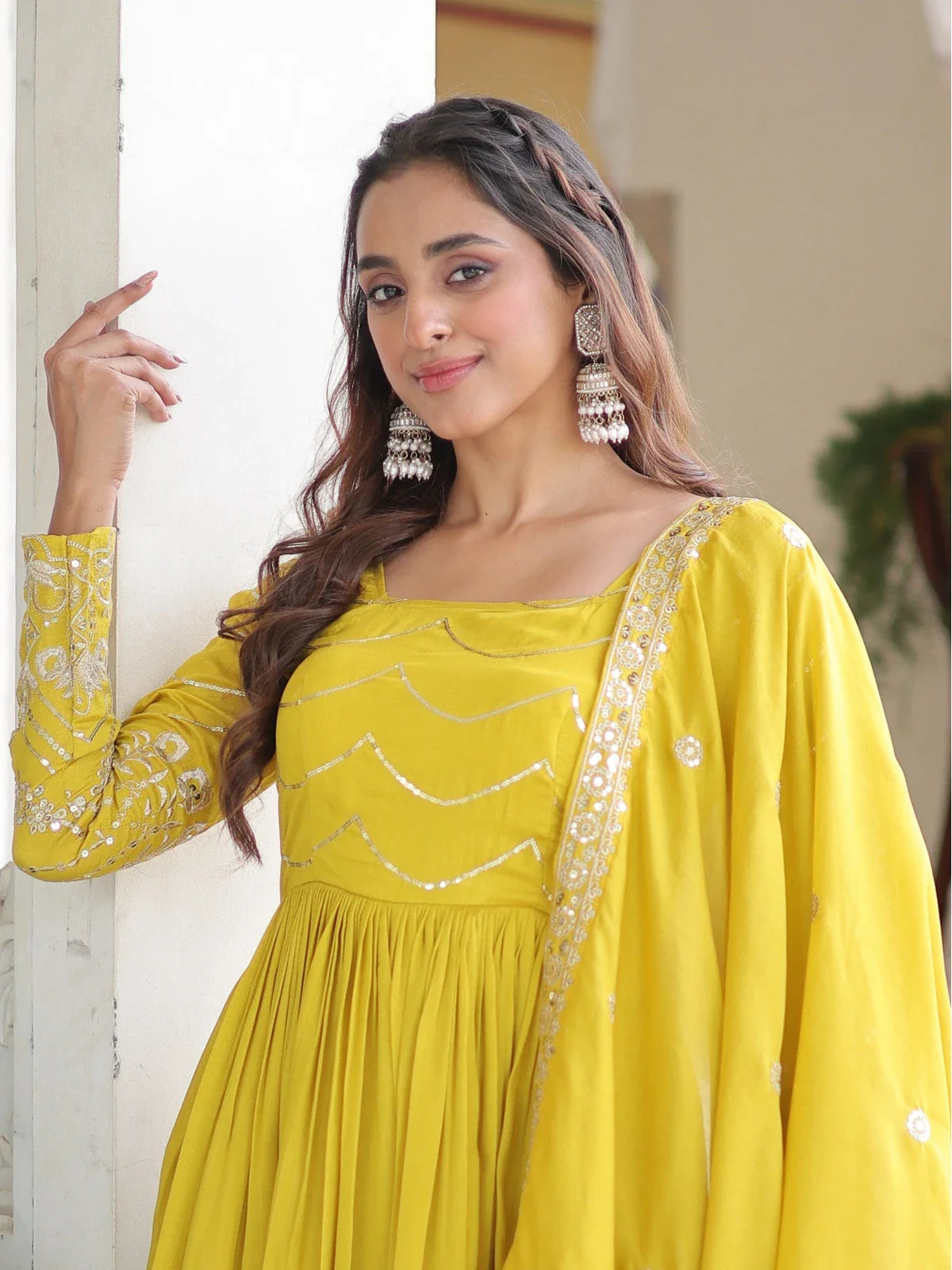 Tarani yellow silk gown close-up showing square neck and full sleeves with embroidery – upper body view