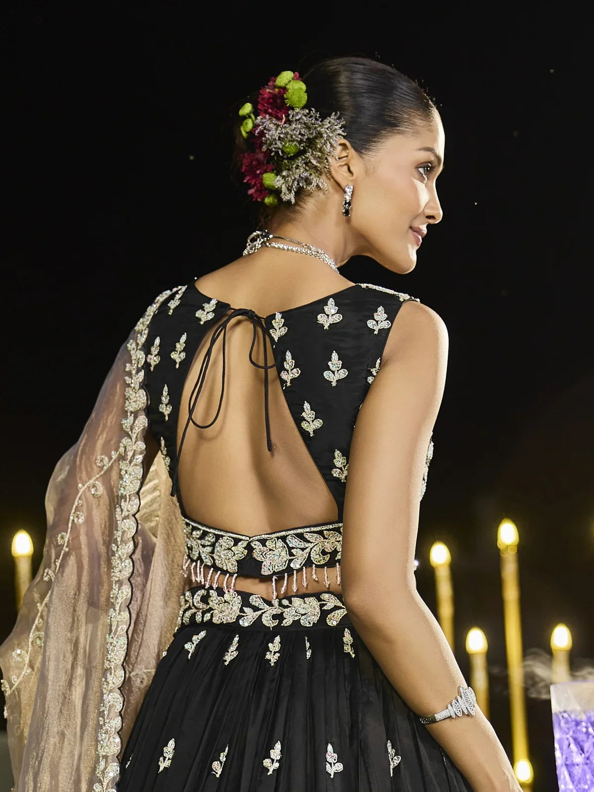 Tarani black satin silk lehenga back view with open back blouse design and embroidery