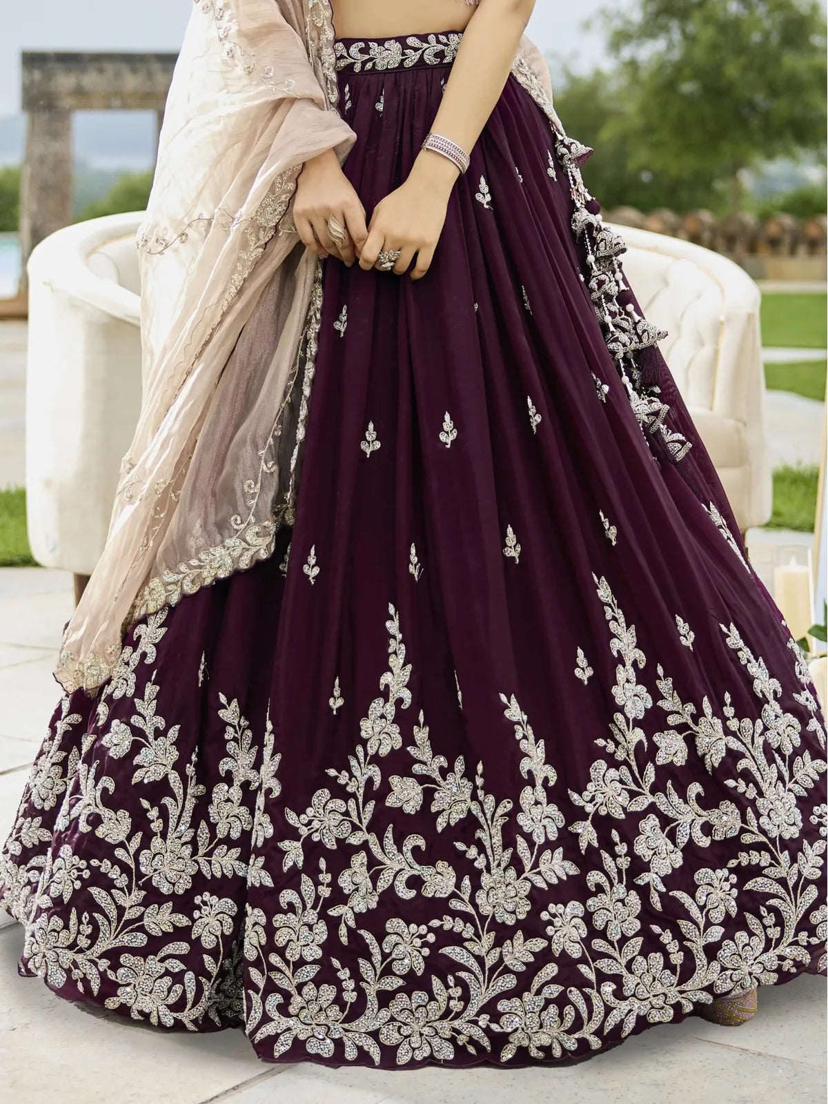 Tarani black satin silk lehenga closeup view with heavy embroidery and cutwork border