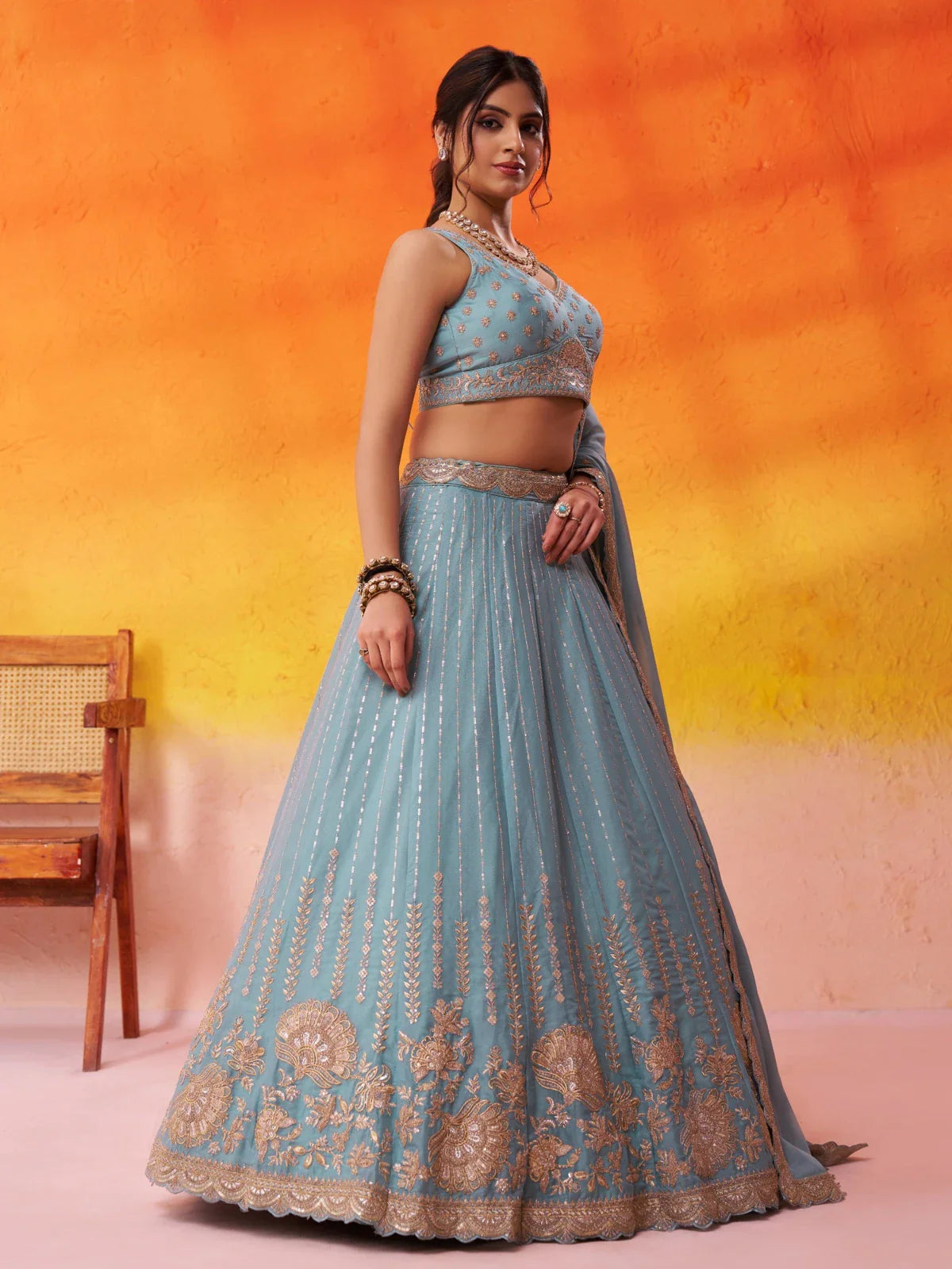 Tarani elegant side view of tissue silk blue lehenga with full flair and sequin detailing