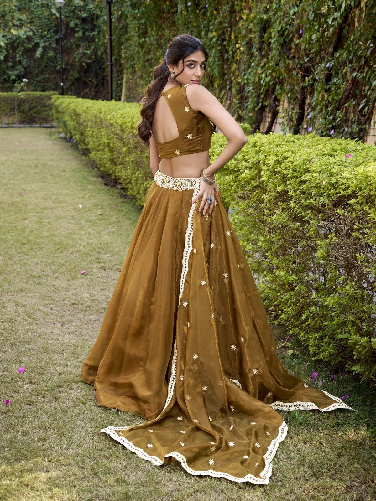 Tarani festive brown lehenga with dupatta drape and back blouse design