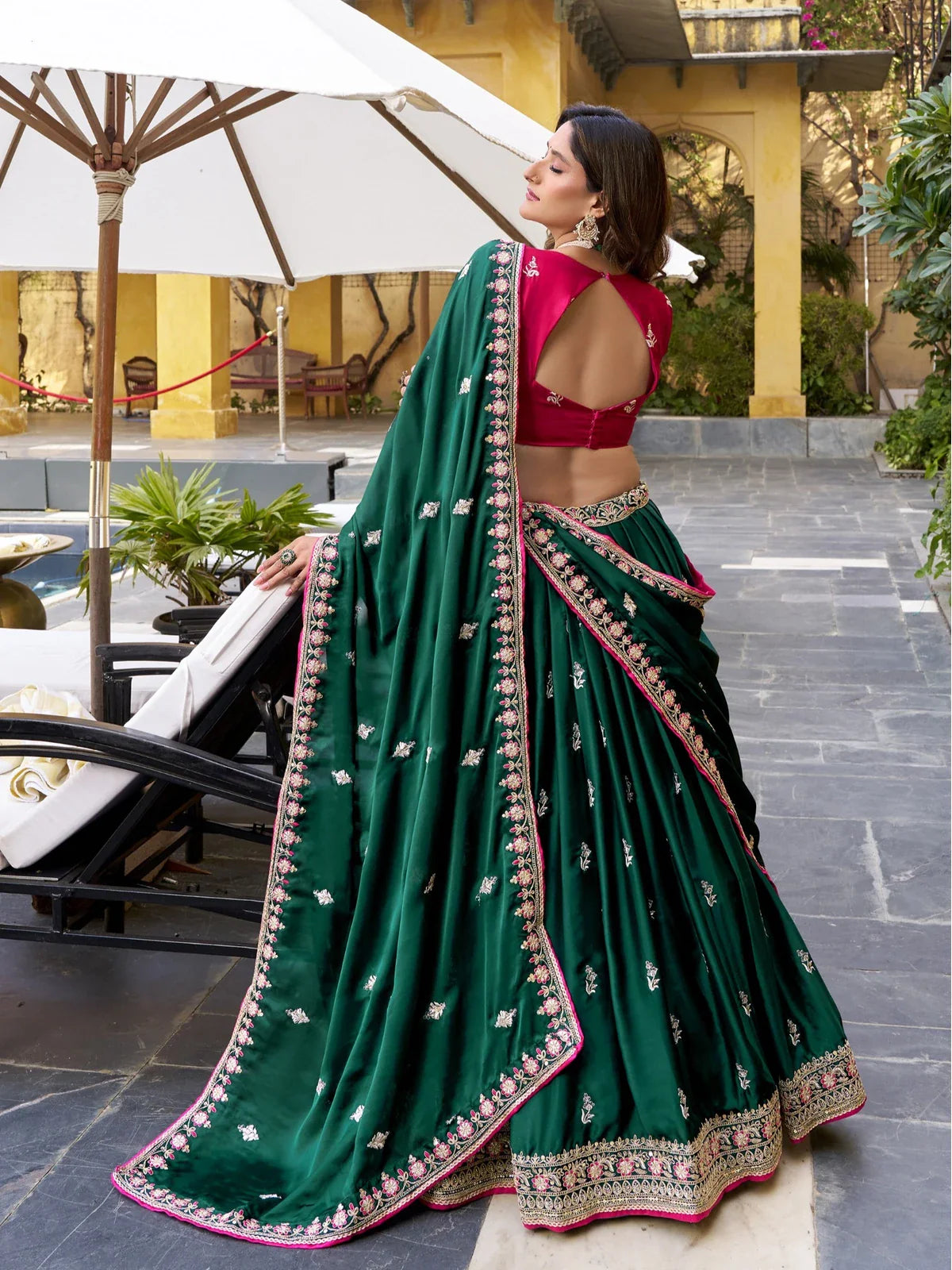 Tarani back pose showing lehenga drape and blouse back design in contrast color