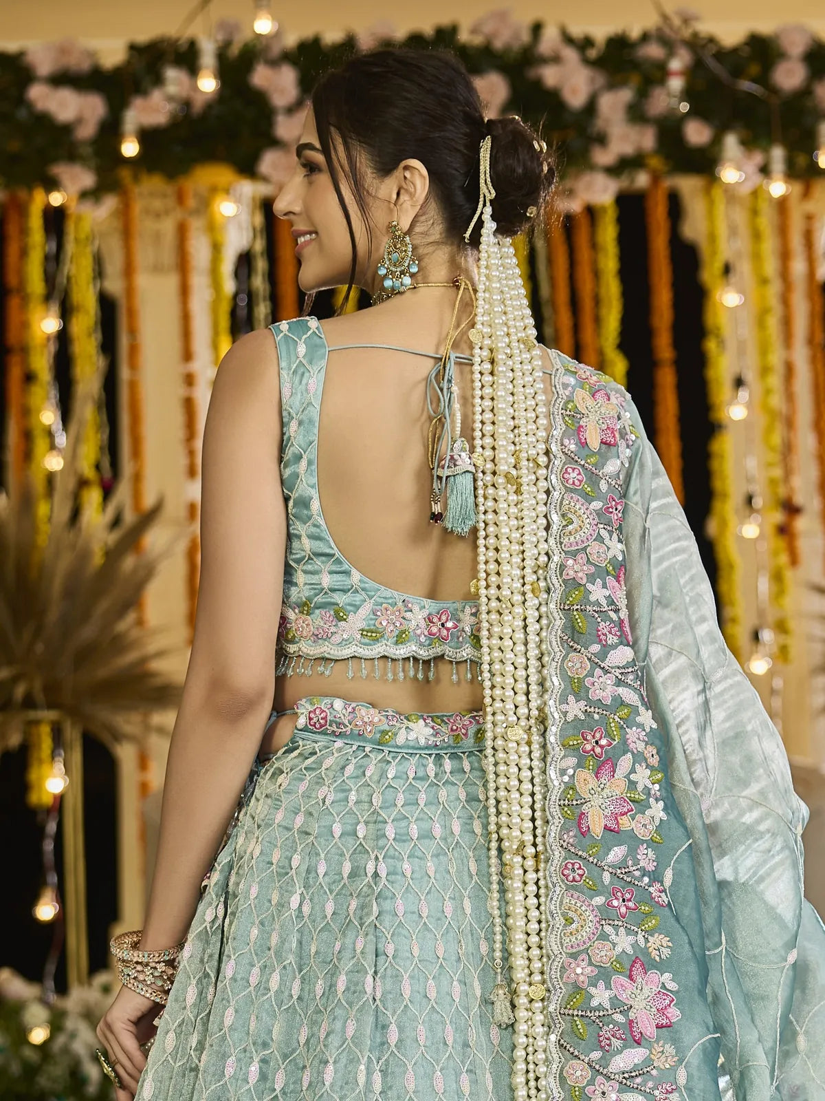 Tarani green silk lehenga back view showing embroidered blouse and dupatta