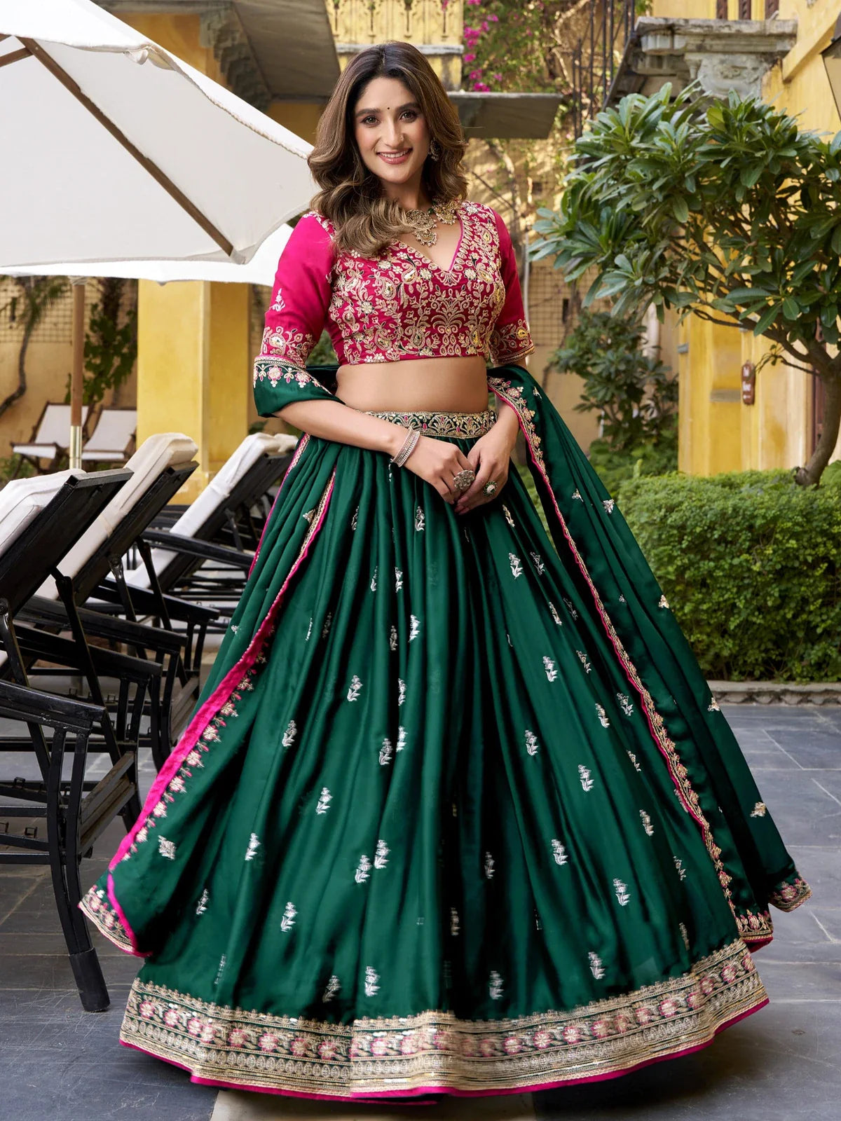 Tarani green lehenga front pose with embroidered border and flowing flair