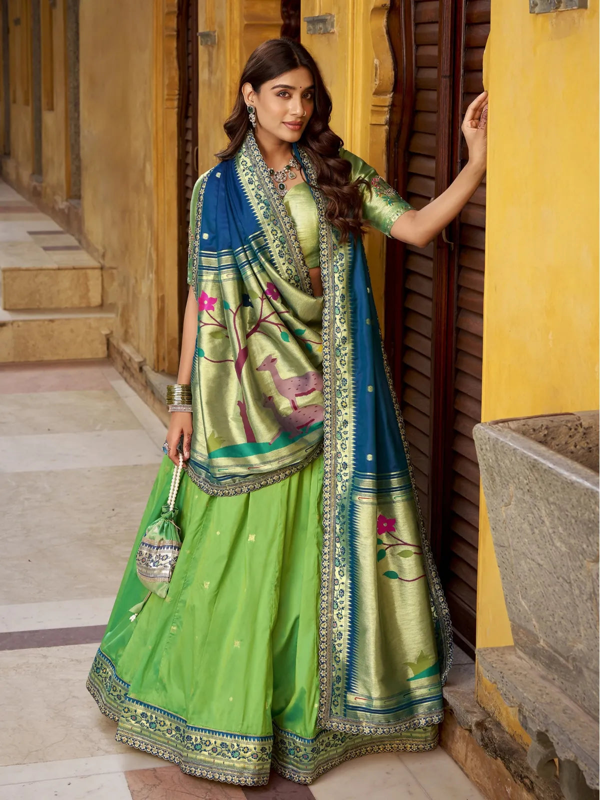 Tarani green silk lehenga full view with rich zari embroidery and festive border design