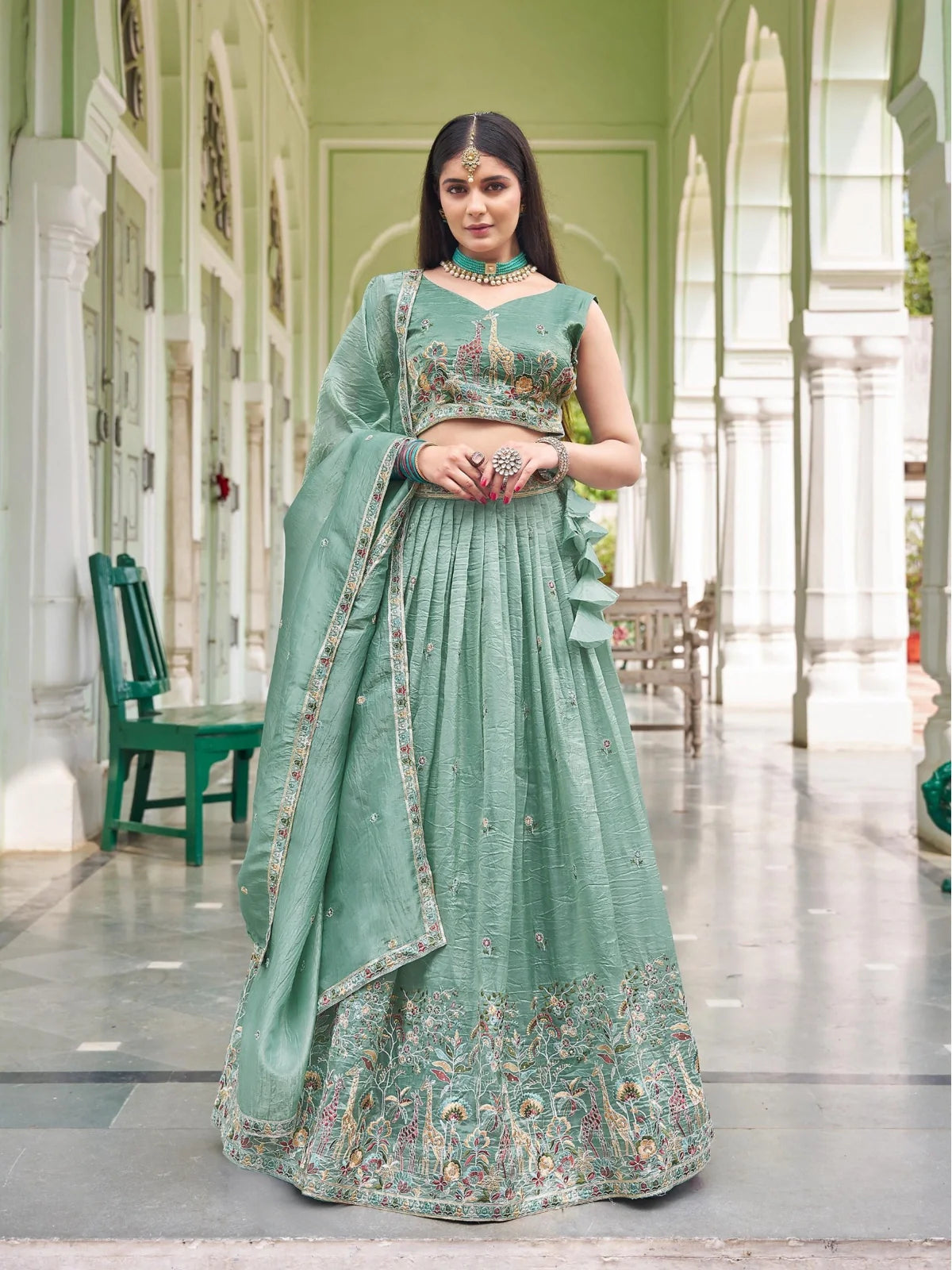 Tarani premium green silk lehenga with embroidery and sequin work styled for festive and wedding occasions