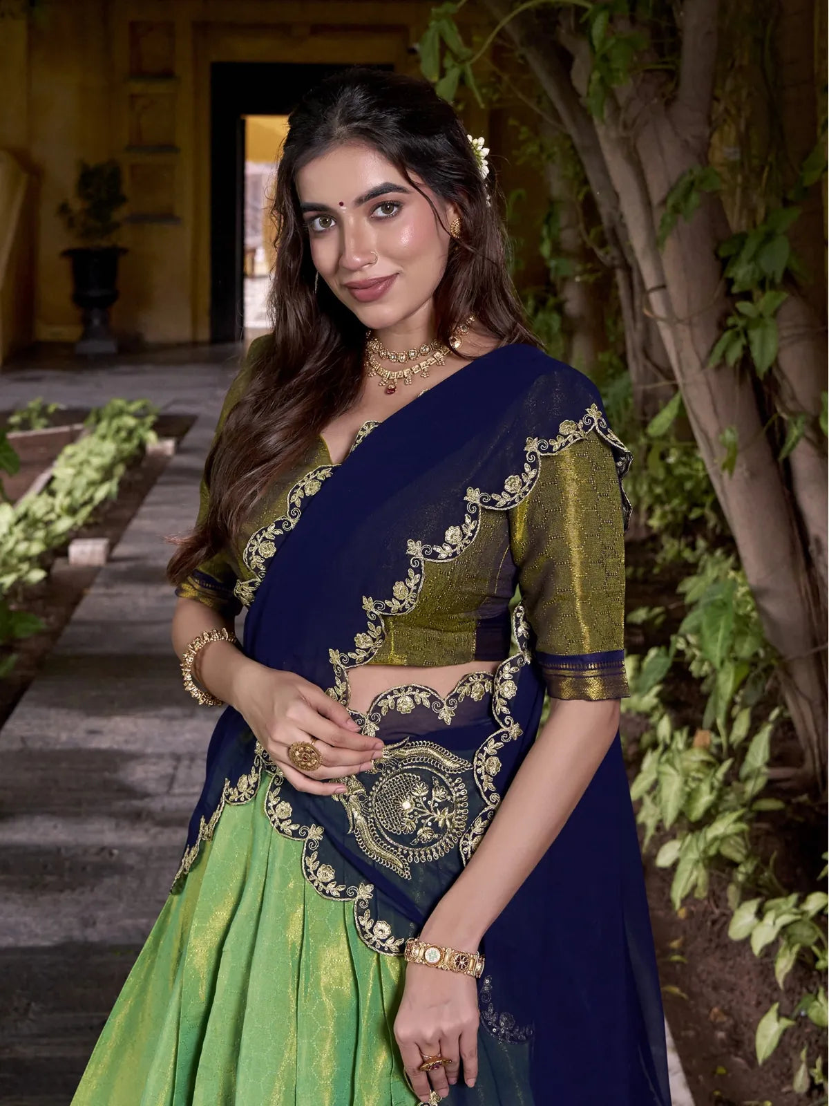 Tarani green lehenga with zari blouse and detailed scallop dupatta upper body view