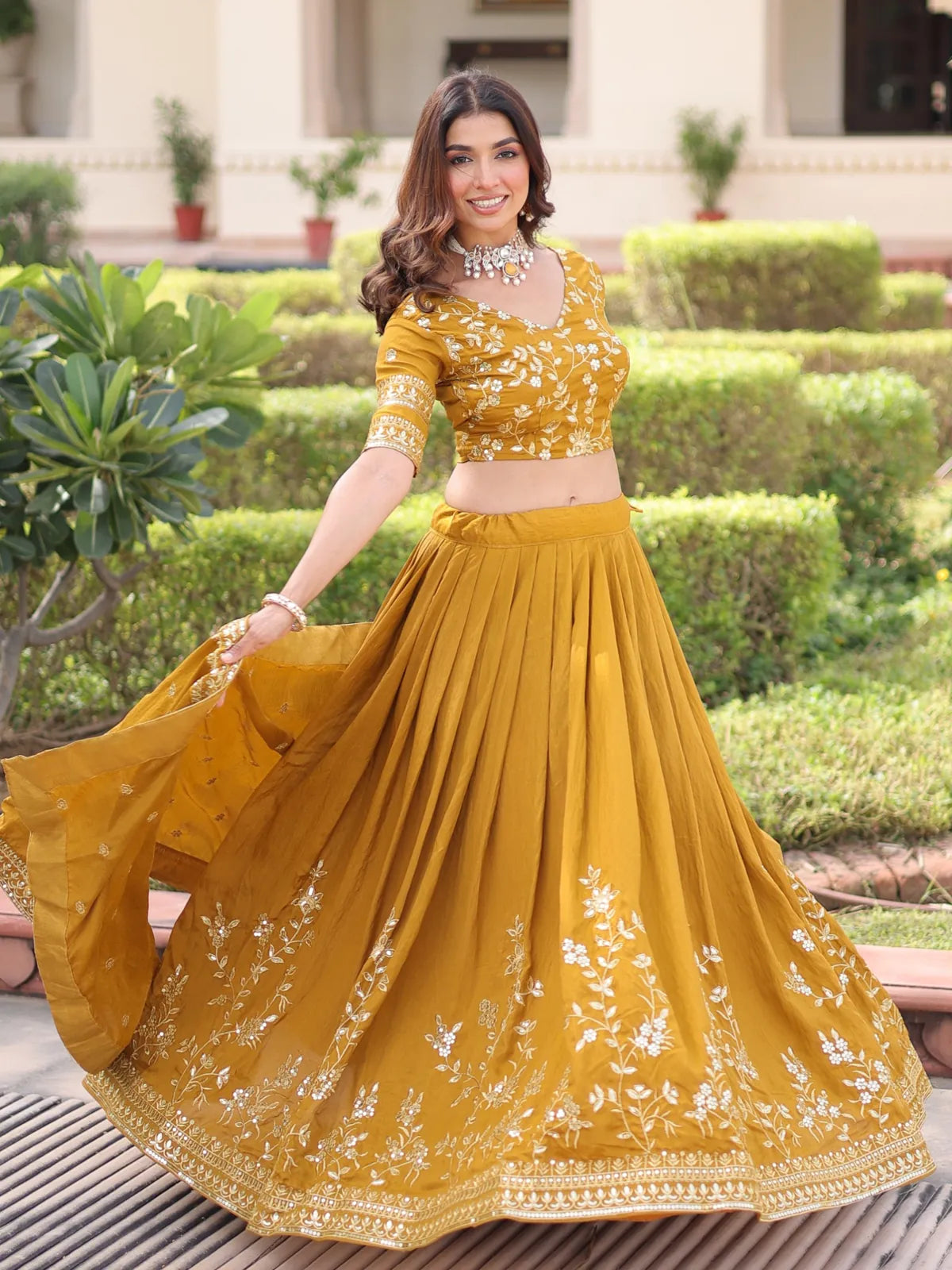 Tarani mustard lehenga full flair front twirl view with elegant embroidery and styling
