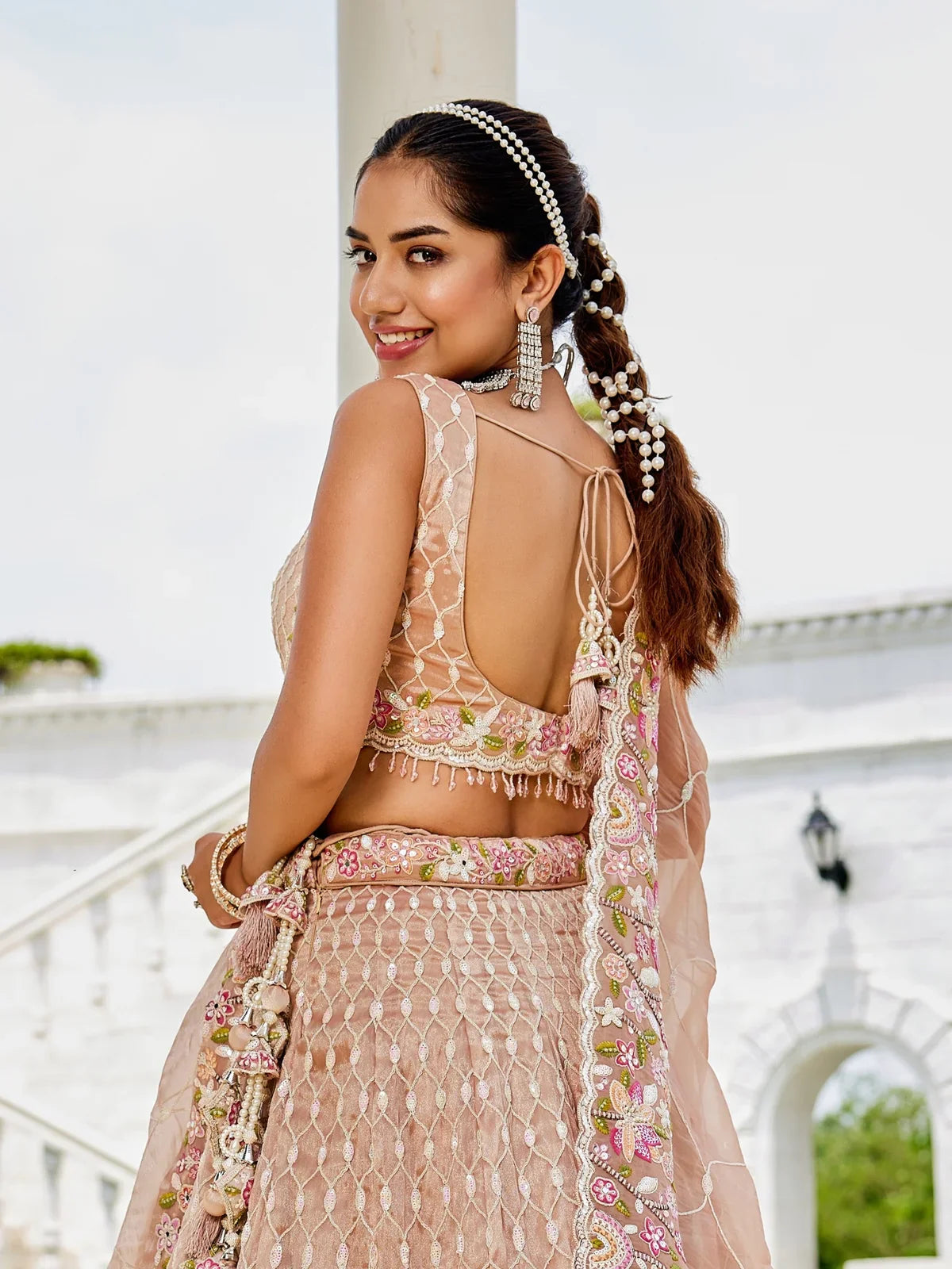 Tarani peach satin silk lehenga back view with blouse design and dupatta
