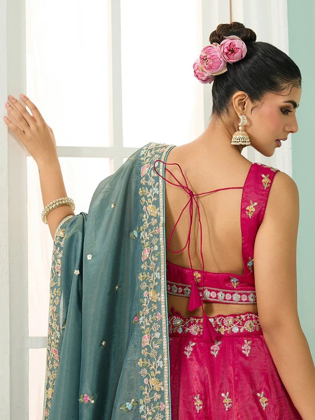 Tarani back view of pink silk lehenga blouse and dupatta with tassel detail