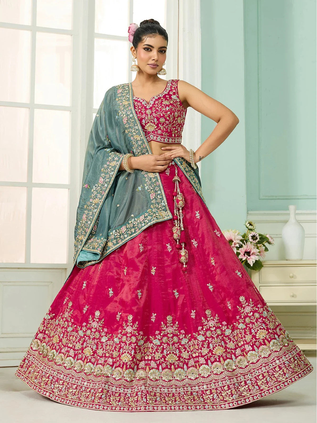 Tarani pink silk lehenga with teal dupatta and embroidered blouse perfect for weddings and festive wear