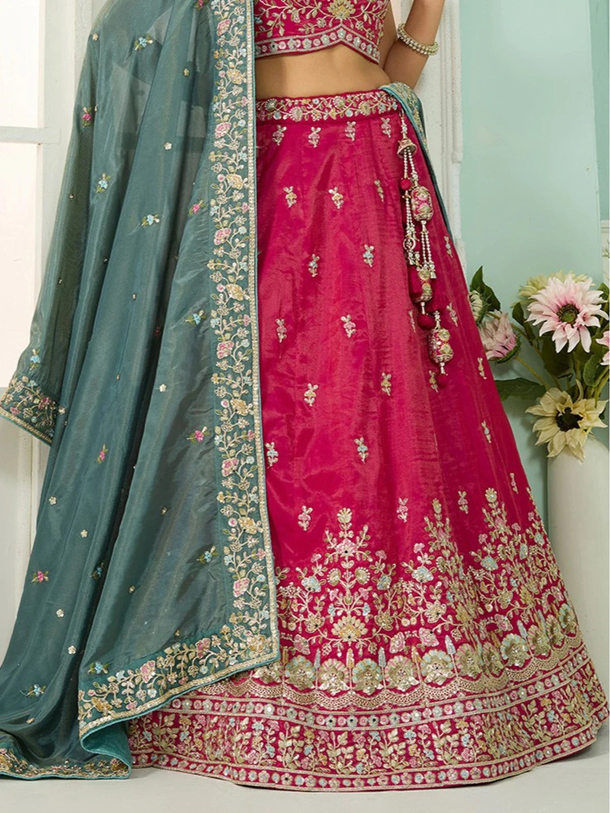 Tarani teal dupatta pallu view with floral embroidery and golden thread work