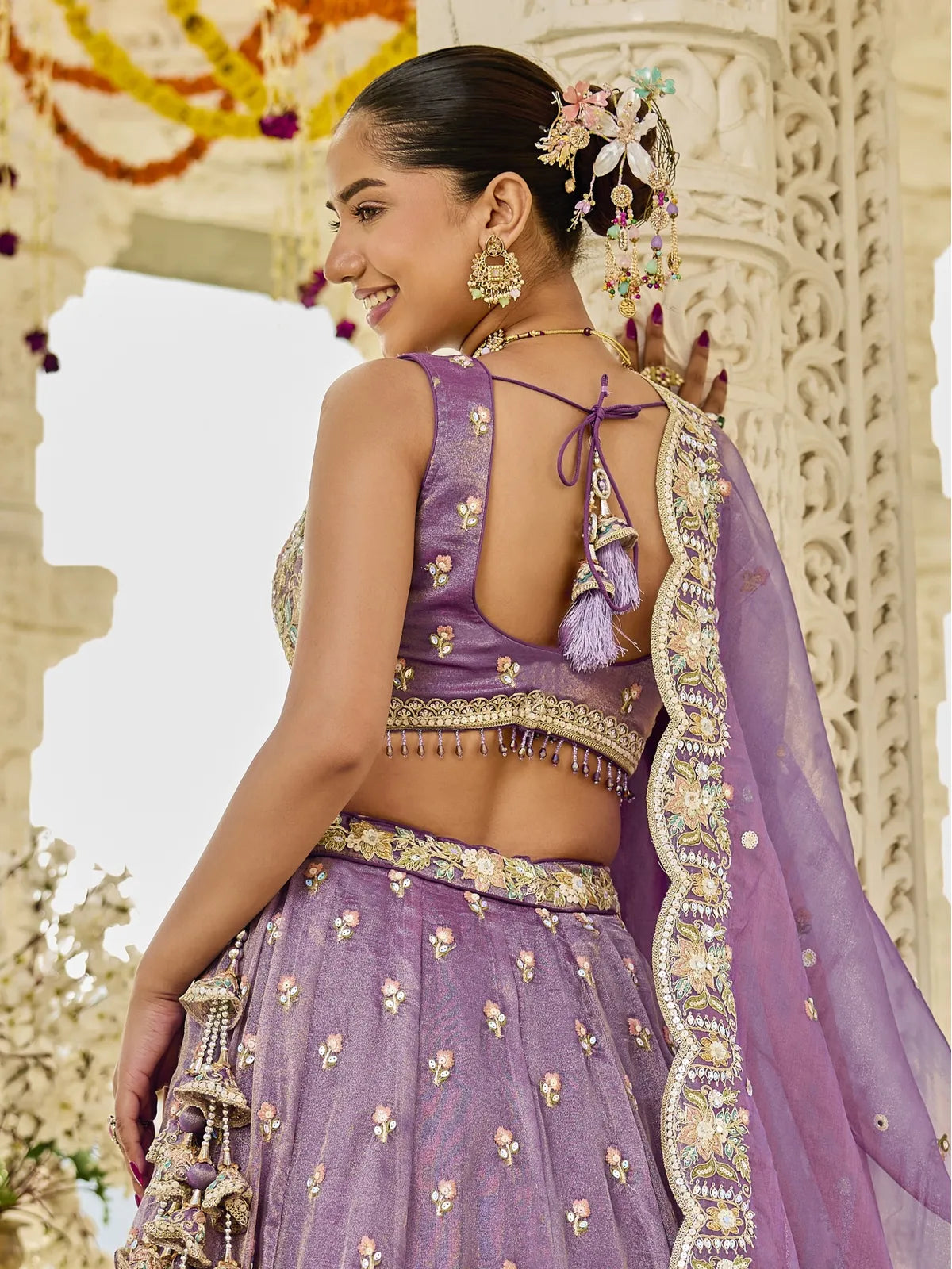 Tarani purple satin silk lehenga back view with tassel blouse design