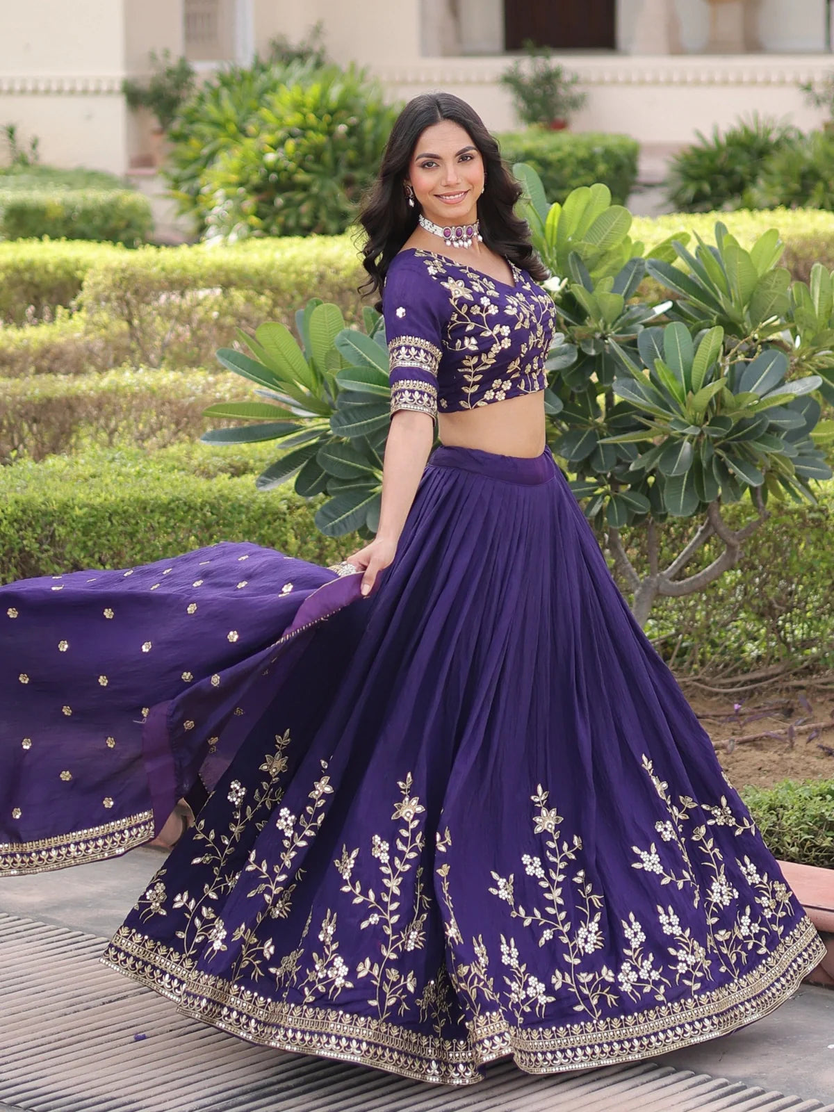 Tarani purple lehenga swirling view highlighting flair and embroidery details