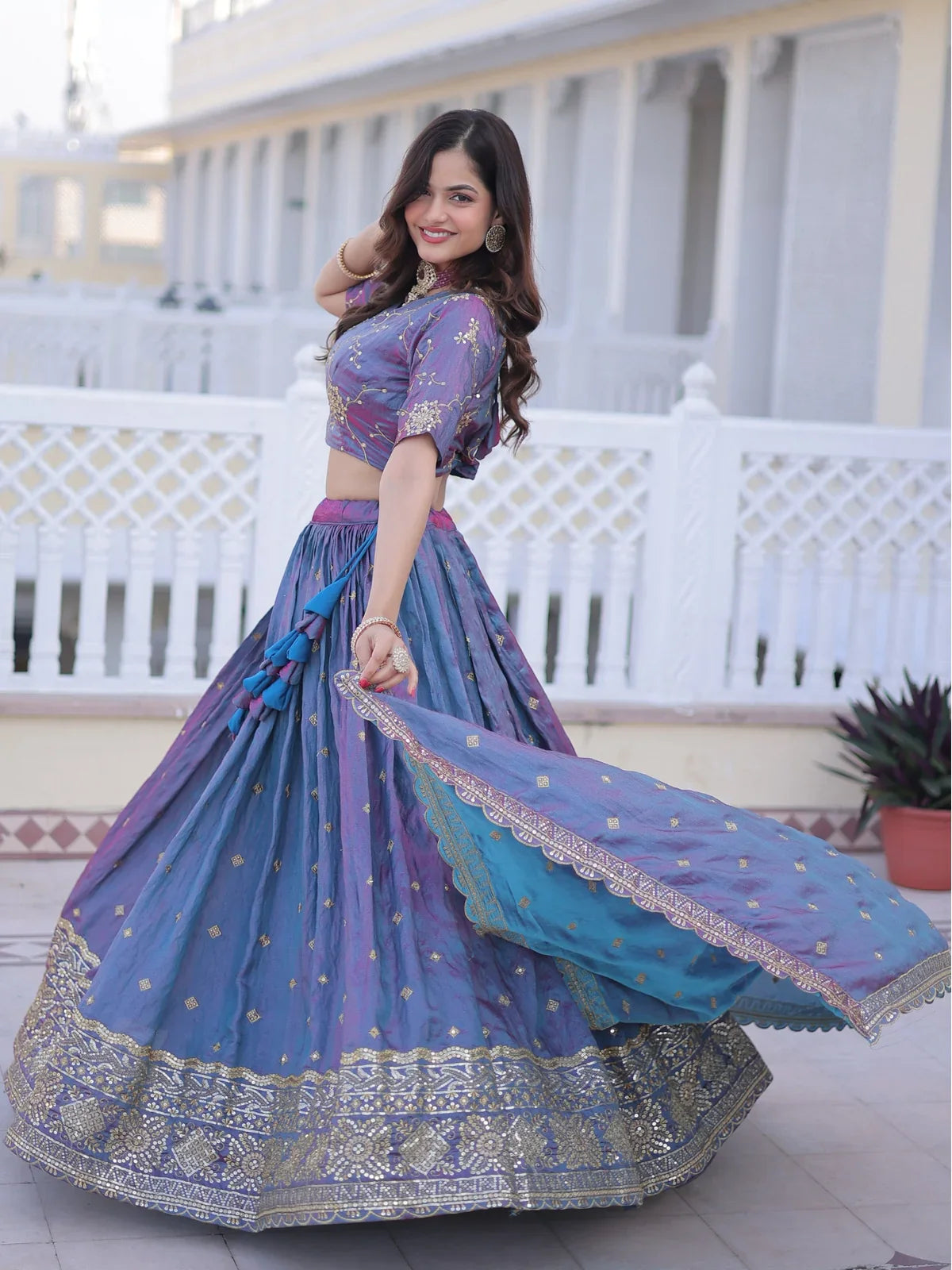 Tarani purple lehenga with cutwork dupatta and zari border pallu gracefully flowing