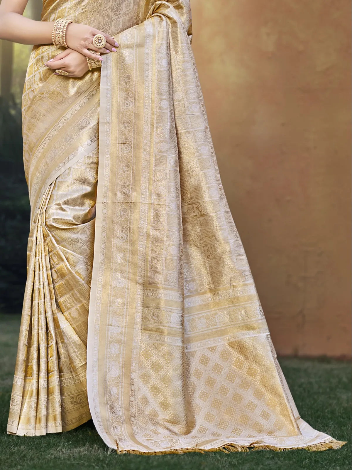 Tarani beige kanjivaram silk saree close pallu view highlighting zari border
