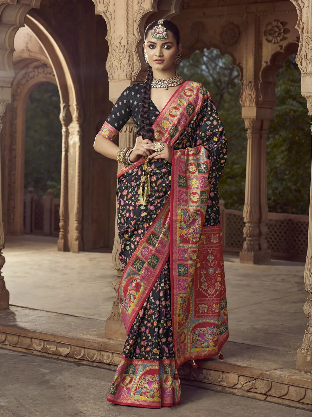 Tarani black silk saree with traditional artwork and colorful pallu for festive occasions