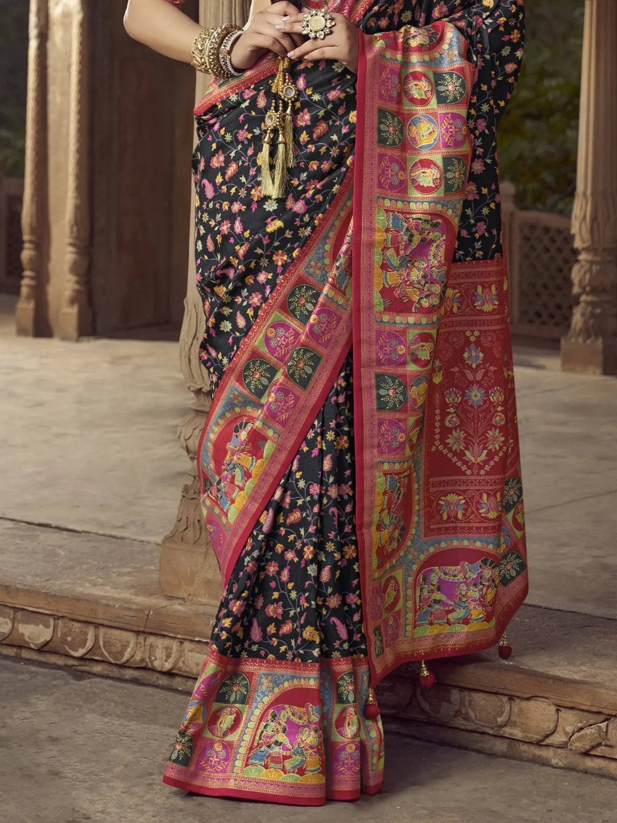 Tarani black silk saree pallu close-up view with traditional motifs and fine zari detailing