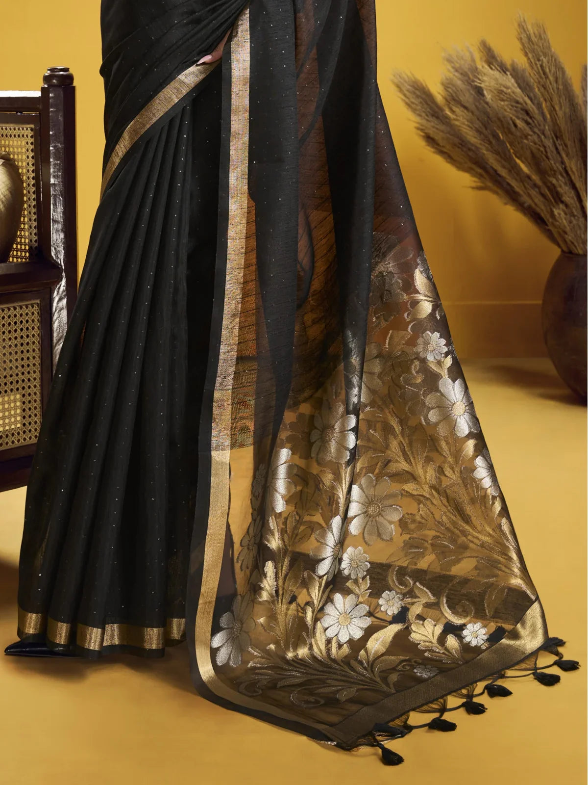 Tarani munga silk black saree with handwoven pallu showing floral weaving and shimmer