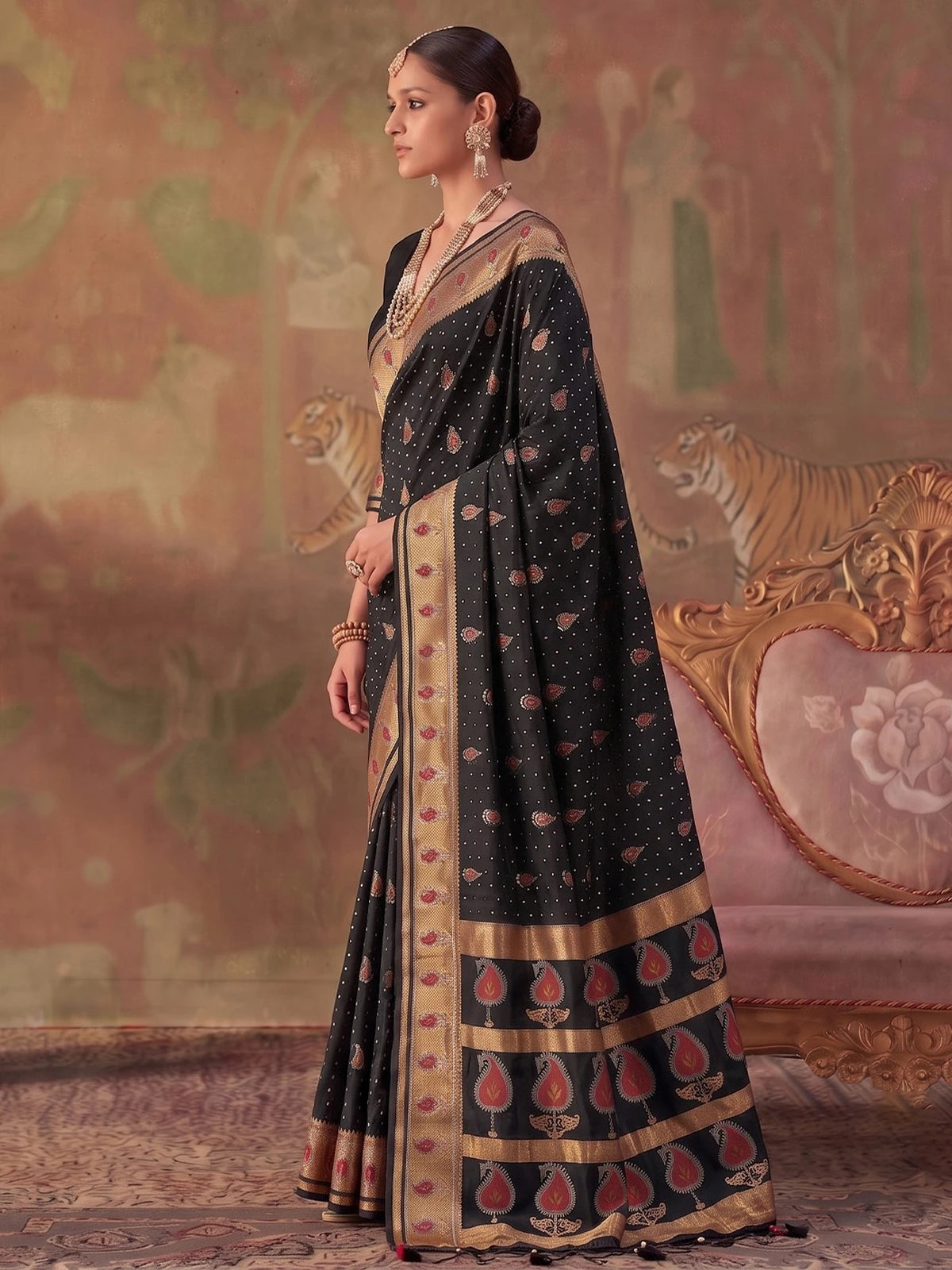 Tarani black silk saree side view highlighting zari border and woven motifs