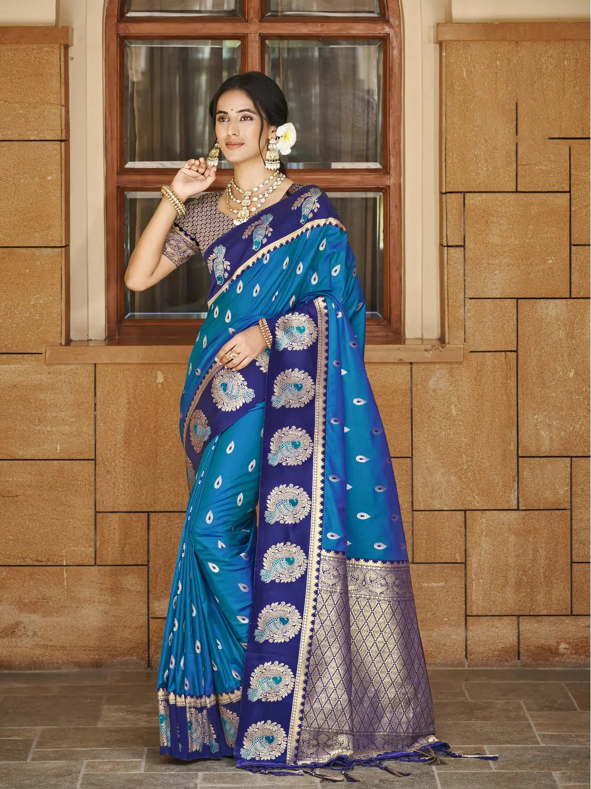 Tarani deep blue silk saree full view with golden zari motifs and peacock designs