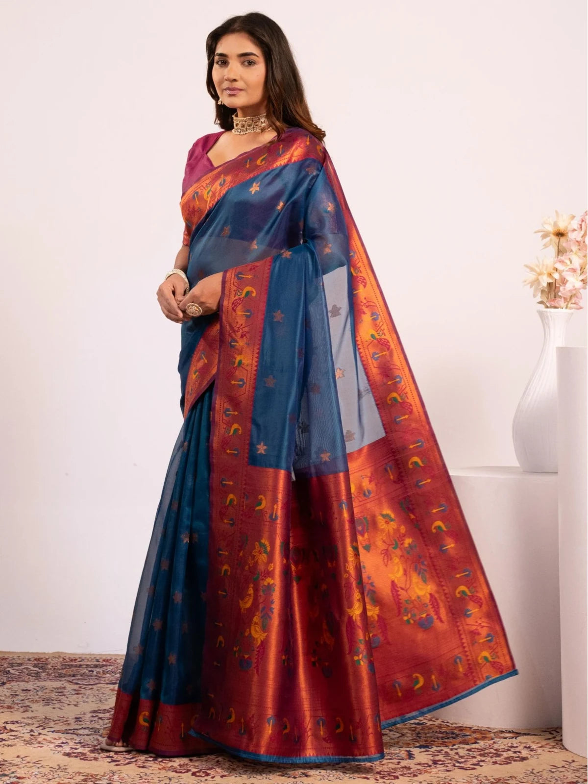 Tarani premium blue Paithani soft tissue silk saree side-view with zari woven border