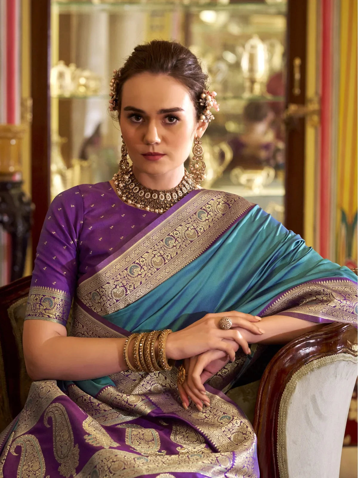 Tarani elegant blue silk saree upper body view with purple blouse and zari border