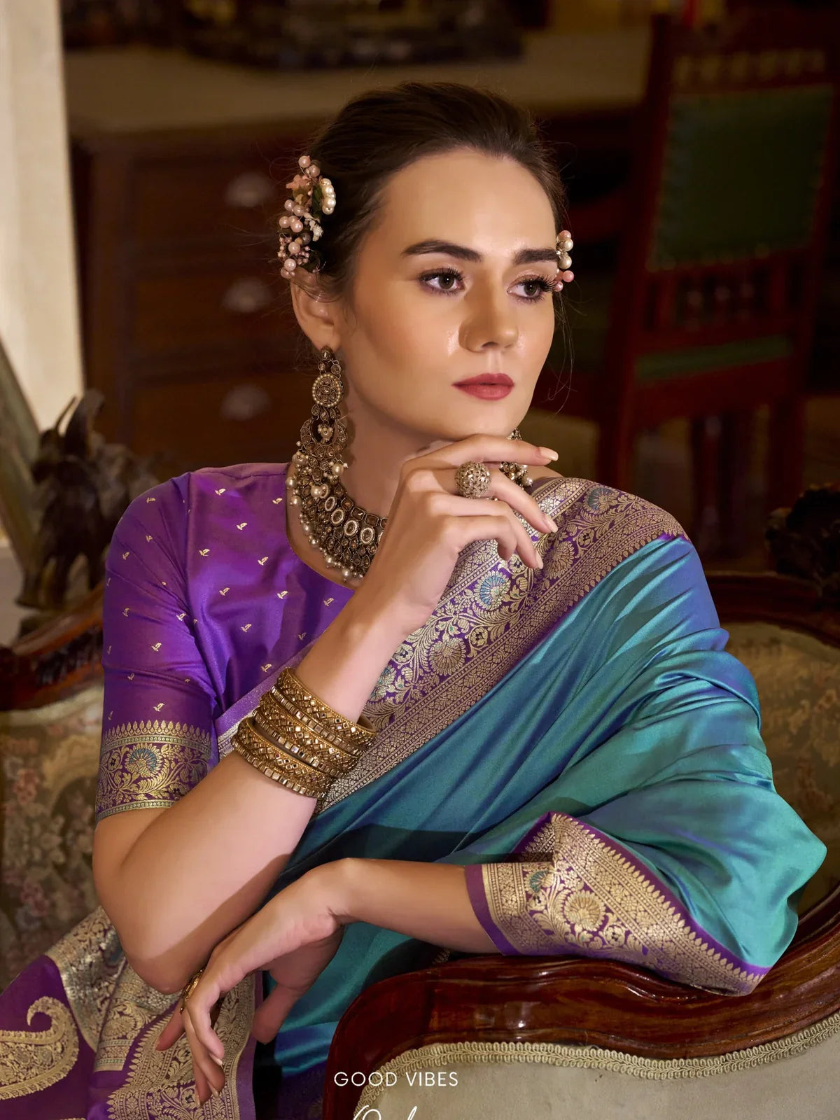 Tarani stylish blue silk saree upper body view close up with jewellery and blouse