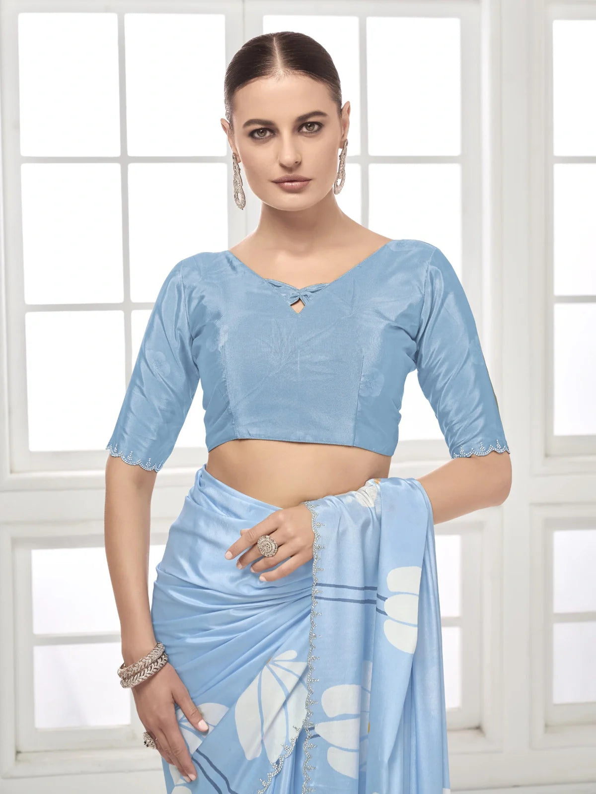 Tarani upper body close-up of blue silk crape saree with blouse and delicate embroidery