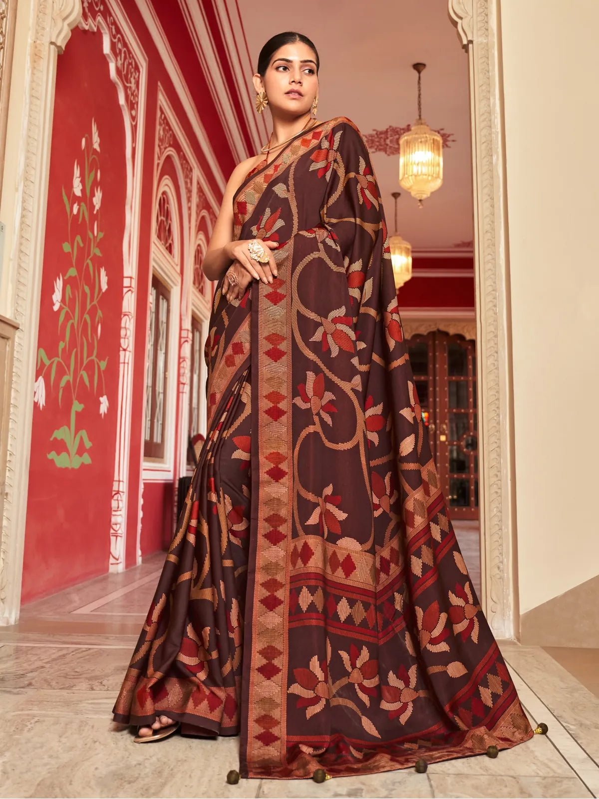 Tarani brown silk saree with woven floral motifs and zari border perfect for festive wedding functions