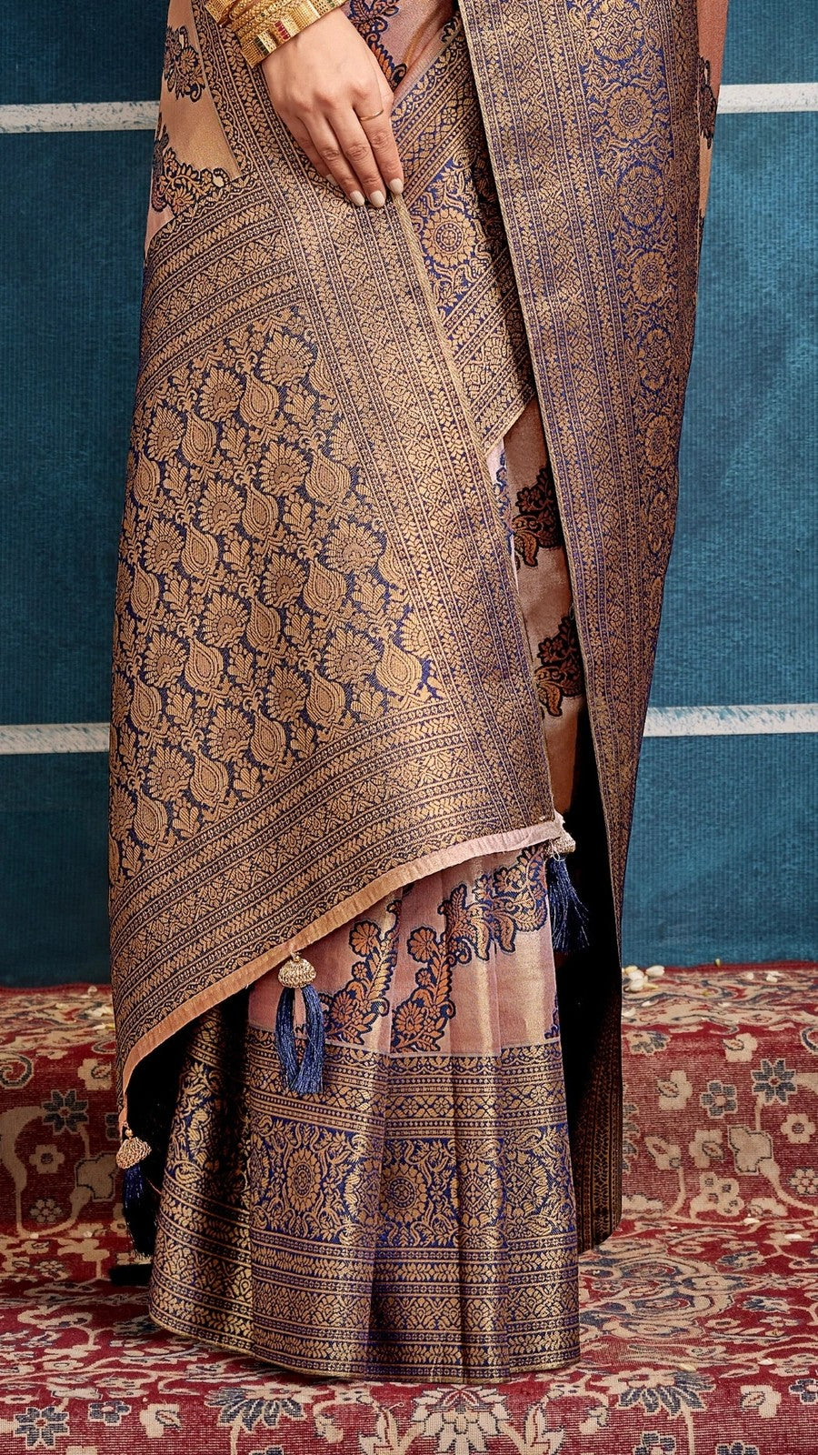 Tarani brown silk saree close-up of pallu and border weaving with tassel detail