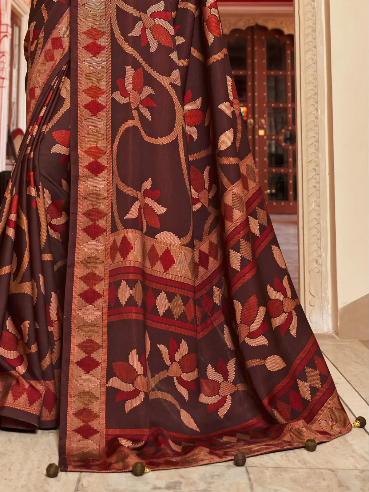 Tarani brown silk saree with bold woven floral pallu and zari edging perfect for wedding functions