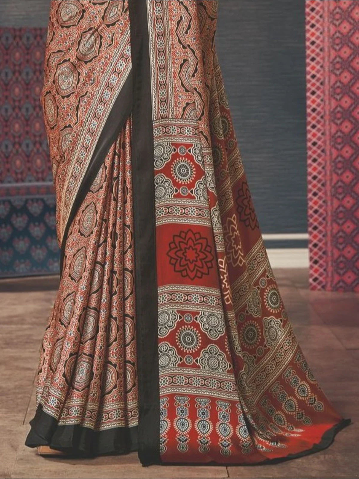 Tarani brown silk saree pallu close-up showing intricate ajrakh-inspired patterns and fine border