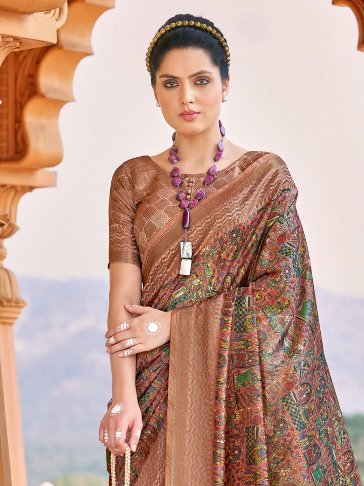 Tarani brown silk saree upper body close view showing elegant blouse and jewelry